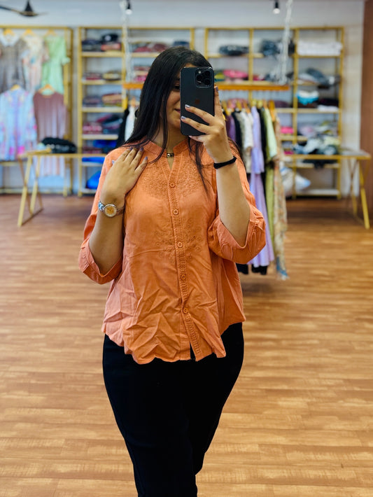 Orange cotton embroidery top with black mom fit denim pant